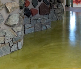The newly resurfaced concrete floor's texture compliments the stone textured walls in this facility at Southern Connecticut State University (SCSU). (thumbnail)