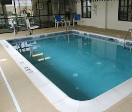 The spray-texture concrete overlay around this pool deck was installed by ESPJ Construction. Spray-texture overlays are decorative and functional as the texture helps prevent slipping in areas where liquids may be present. ESPJ is based in Linden, New Jersey. (thumbnail)